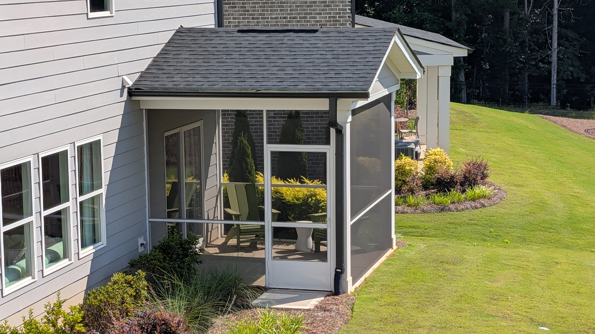 Beautifully finished screened porch at golden hour